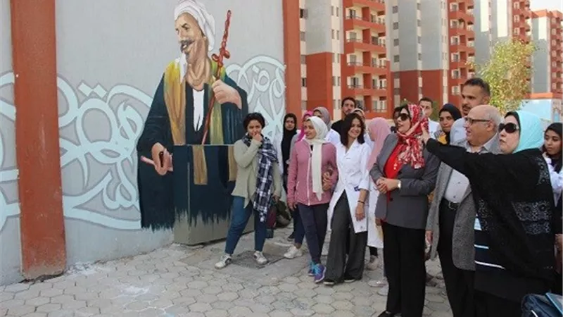 بالصور..جامعة عين شمس تشارك في تجميل حي الأسمرات