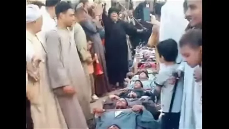 تفاصيل فيديو لـ استلقاء أشخاص وسير رجل على أجسادهم في أسيوط