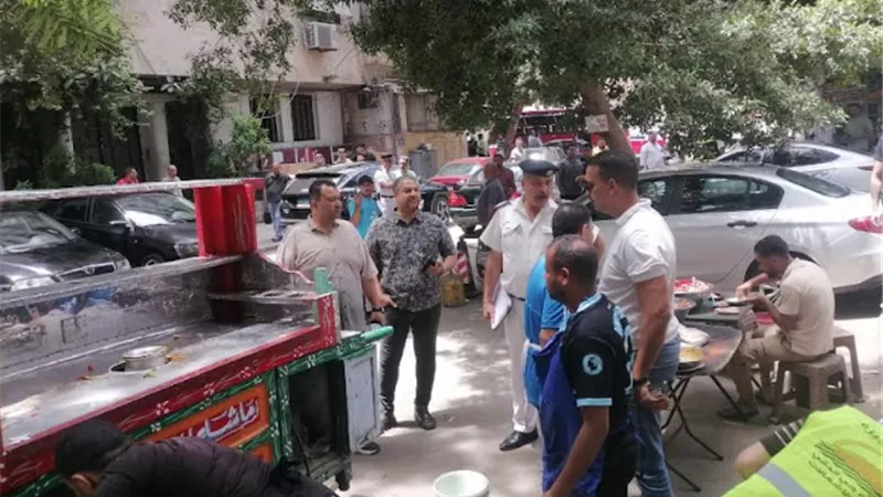تشميع ٥ محلات غير مرخصة بالدقي ورفع عشرات الاشغالات
