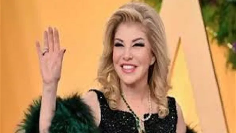 هالة سرحان تدافع عن هاني فرحات بعد تقبيل يد محمد عبده