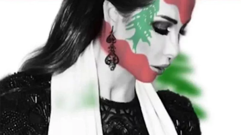 نانسى عجرم تدعم لبنان بعلم على وجهها