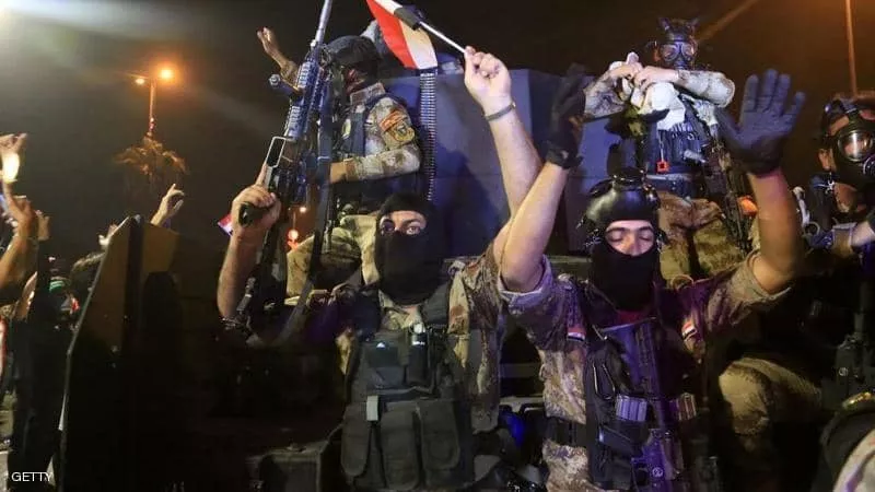مسؤول عراقي : ملثم يفتح النار على محتجين في كربلاء ويقتل 13 شخصا