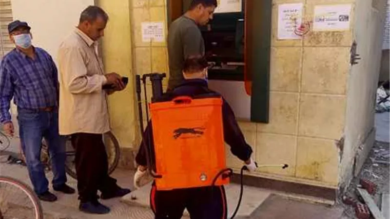 رواتب ابريل. تعقيم البنوك و ماكينات الصراف الألي في الإسماعيلية .صور