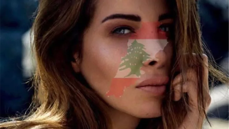 شاهد .. نانسى عجرم تدعم لبنان برسم العلم على وجهها