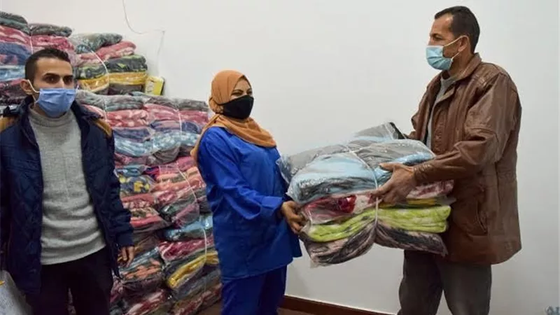 توزيع 1200 بطانية لعمال الجامعة ومشروع النظافة ببنى سويف