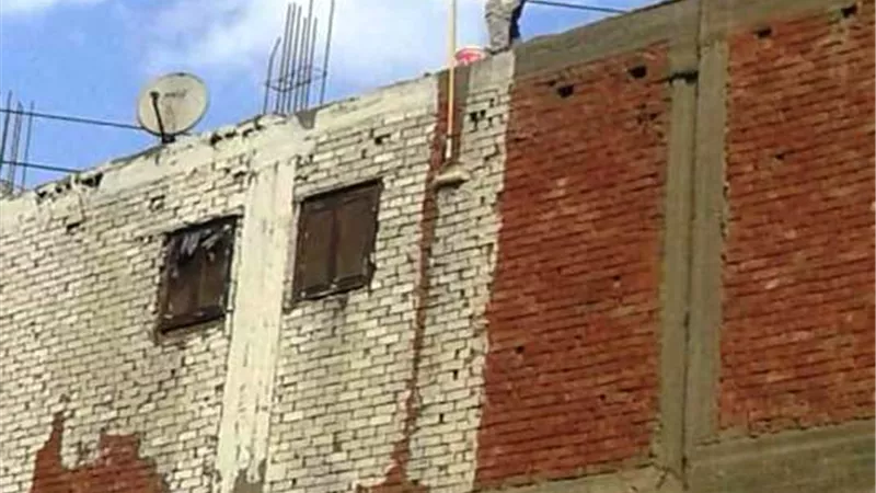 حي العجوزة يبدأ في طلاء العقارات المطلة على الطريق الدائرى بلون موحد