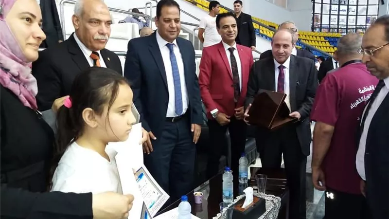 رئيس كهرباء القناة يكرم أسرة الشهيد احمد منسى فى اليوم العالمى للوشو كونج فو