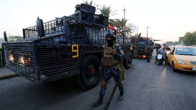 اشتباكات بين قوتين من الشرطة والحشد الشعبي جنوبي العراق