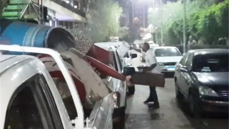 رفع 60 حالة إشغال وباعة جائلين بحديقة السلام في أسوان ..صور