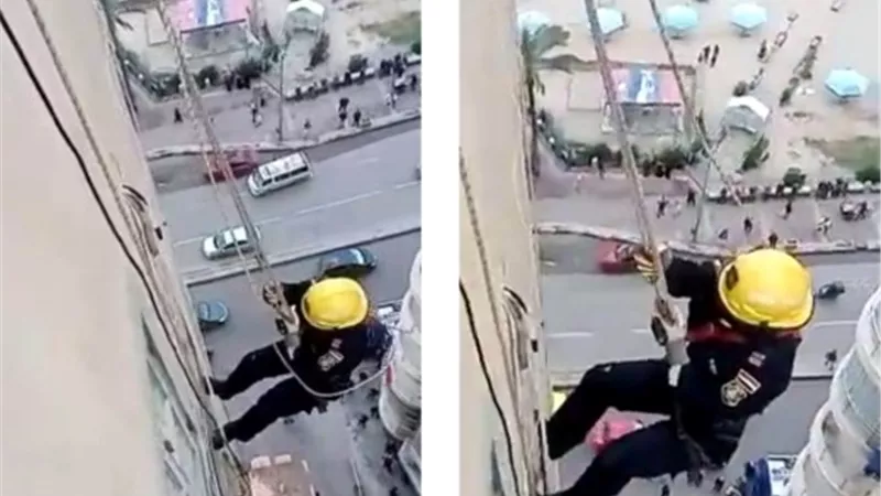 رجال الحماية المدنية ينقذون المارة من تكييف معلق