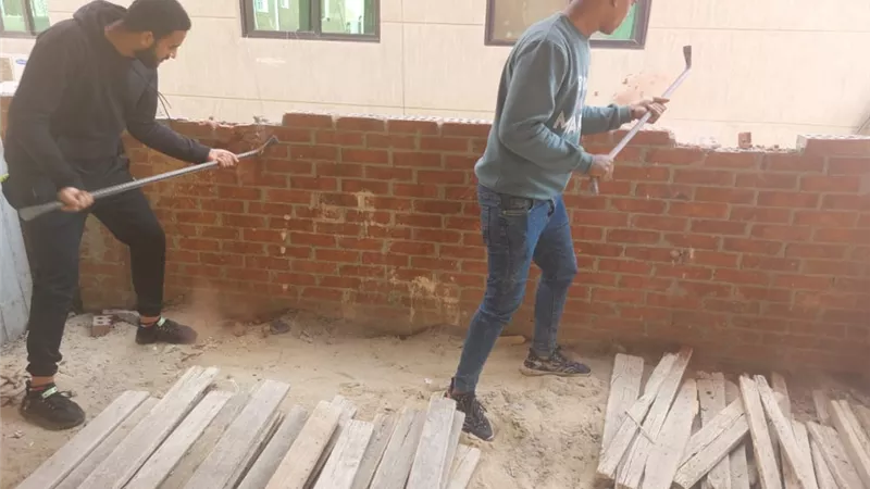 جهاز مدينة 6 أكتوبر يشن حملة على مخالفات البناء فى الأحياء.. صور
